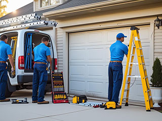 Forest Hills, NY Garage Door Company – Local Technicians at Work Professional garage door technicians loading tools and parts from a service van, preparing for a repair at a Forest Hills, NY home.