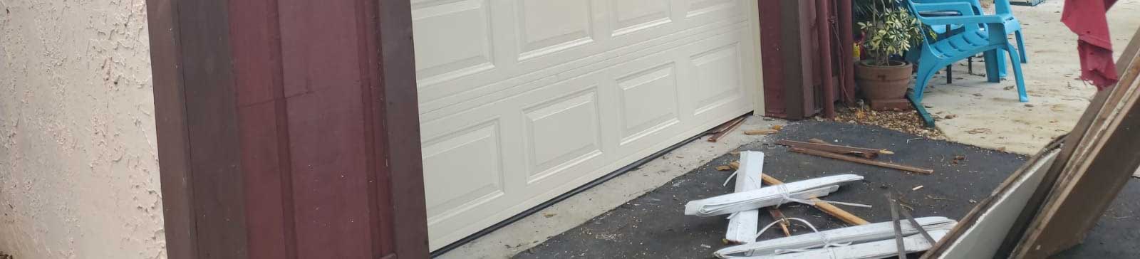 Cream-colored sectional steel garage door after installation in Forest Hills NY garage